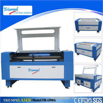 Triumph CE/FDA 60W/80W/100W/130W/150W CO2 Laser Cutting Machine Price with Red DOT/Motorized Z-Axis/Rotary Device